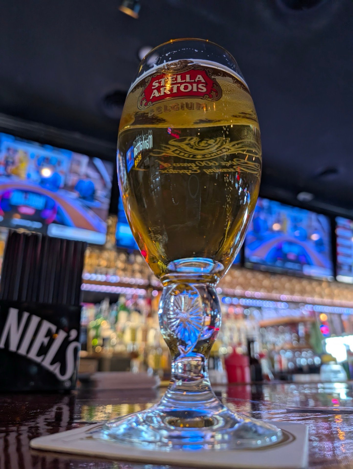 A Stella Artois chalice on the bar